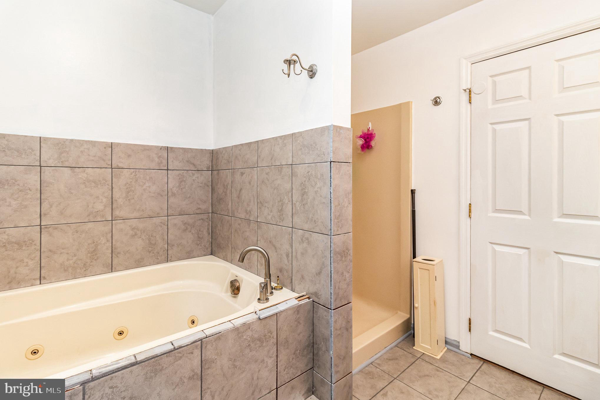 316 House Rock Road Pequea, PA 17565 - Photo 10 of 21 a bathroom with a bathtub and a shower