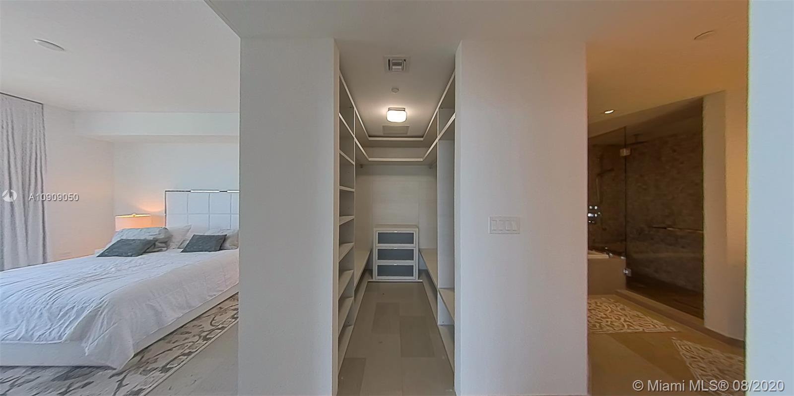 88 Southwest 7th Street, Unit 2911 Miami, FL 33130 - Photo 15 of 25 a bathroom with a sink and a mirror