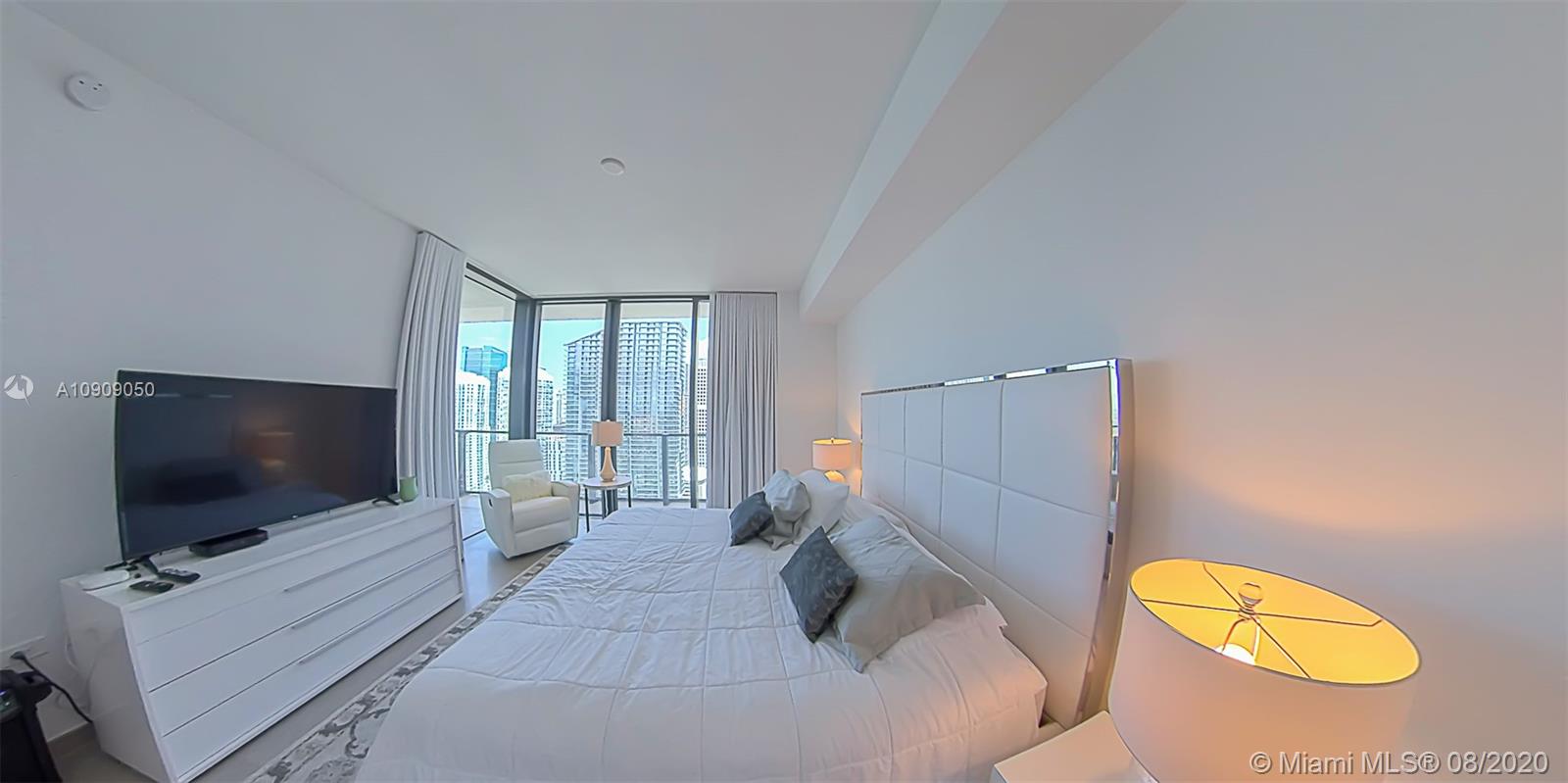 88 Southwest 7th Street, Unit 2911 Miami, FL 33130 - Photo 17 of 25 a living room with furniture and a flat screen tv