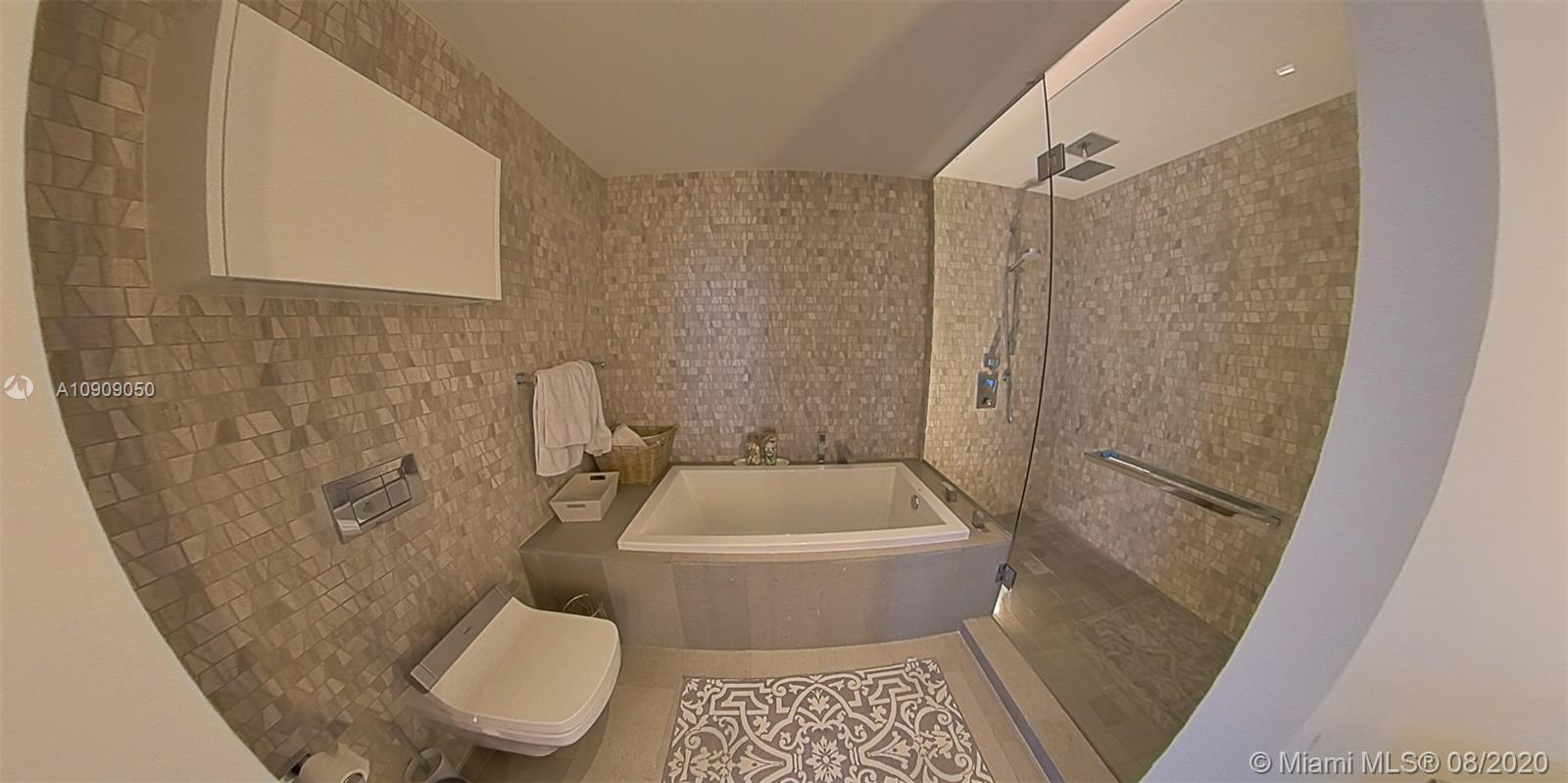88 Southwest 7th Street, Unit 2911 Miami, FL 33130 - Photo 18 of 25 a bathroom with a toilet and a shower