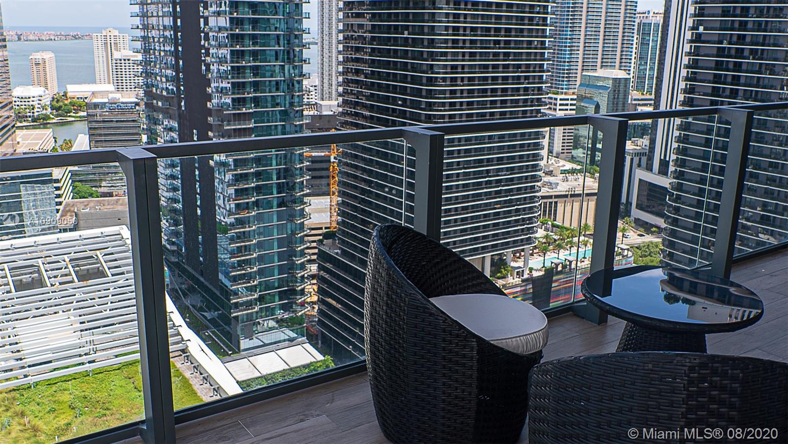 88 Southwest 7th Street, Unit 2911 Miami, FL 33130 - Photo 21 of 25 a front view of a house with a yard