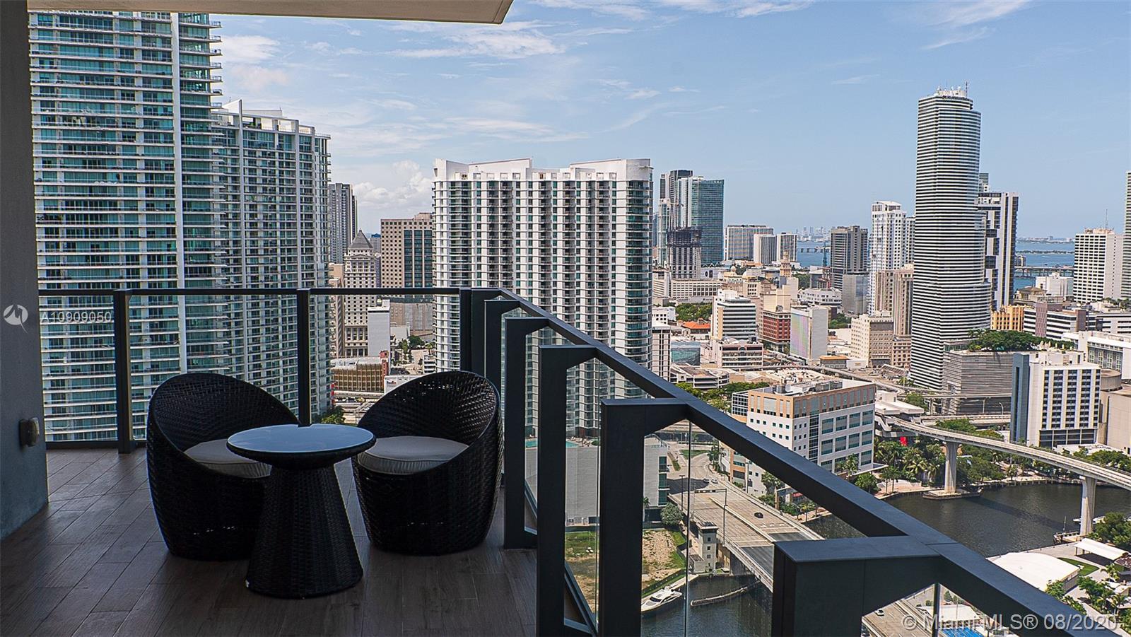 88 Southwest 7th Street, Unit 2911 Miami, FL 33130 - Photo 22 of 25 a view of a balcony with chairs