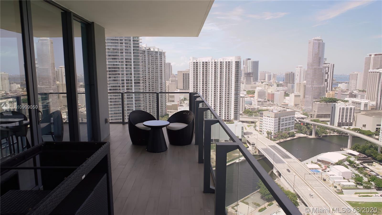 88 Southwest 7th Street, Unit 2911 Miami, FL 33130 - Photo 23 of 25 a view of a living room and a balcony