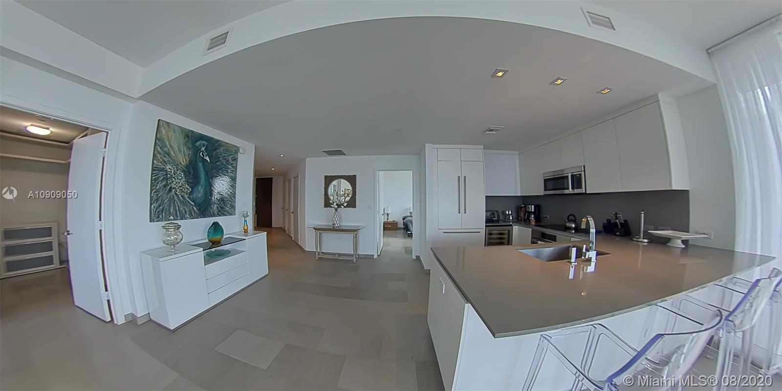 88 Southwest 7th Street, Unit 2911 Miami, FL 33130 - Photo 4 of 25 a living room with furniture and a table