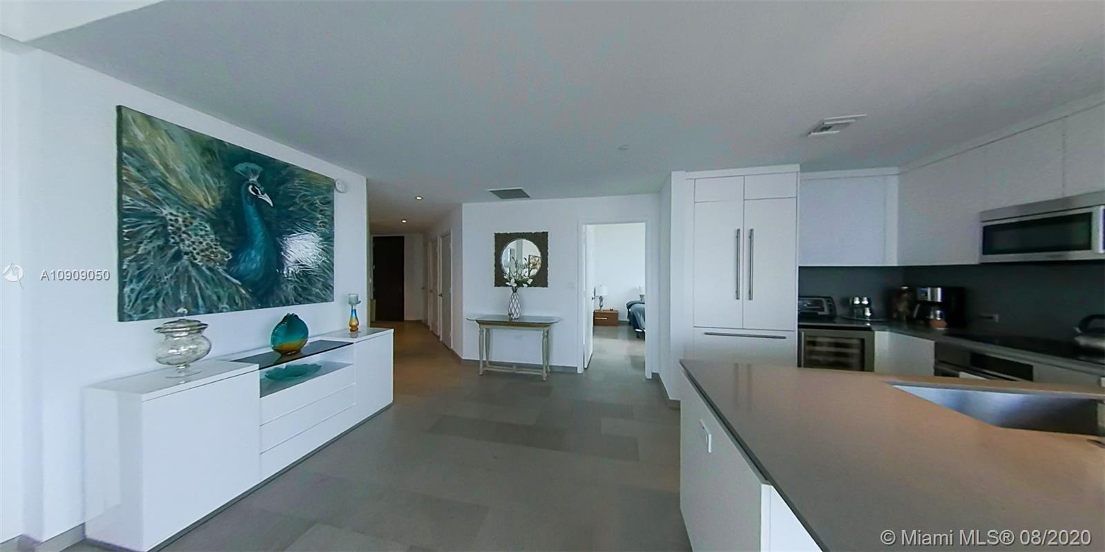 88 Southwest 7th Street, Unit 2911 Miami, FL 33130 - Photo 5 of 25 a living room with furniture and a flat screen tv