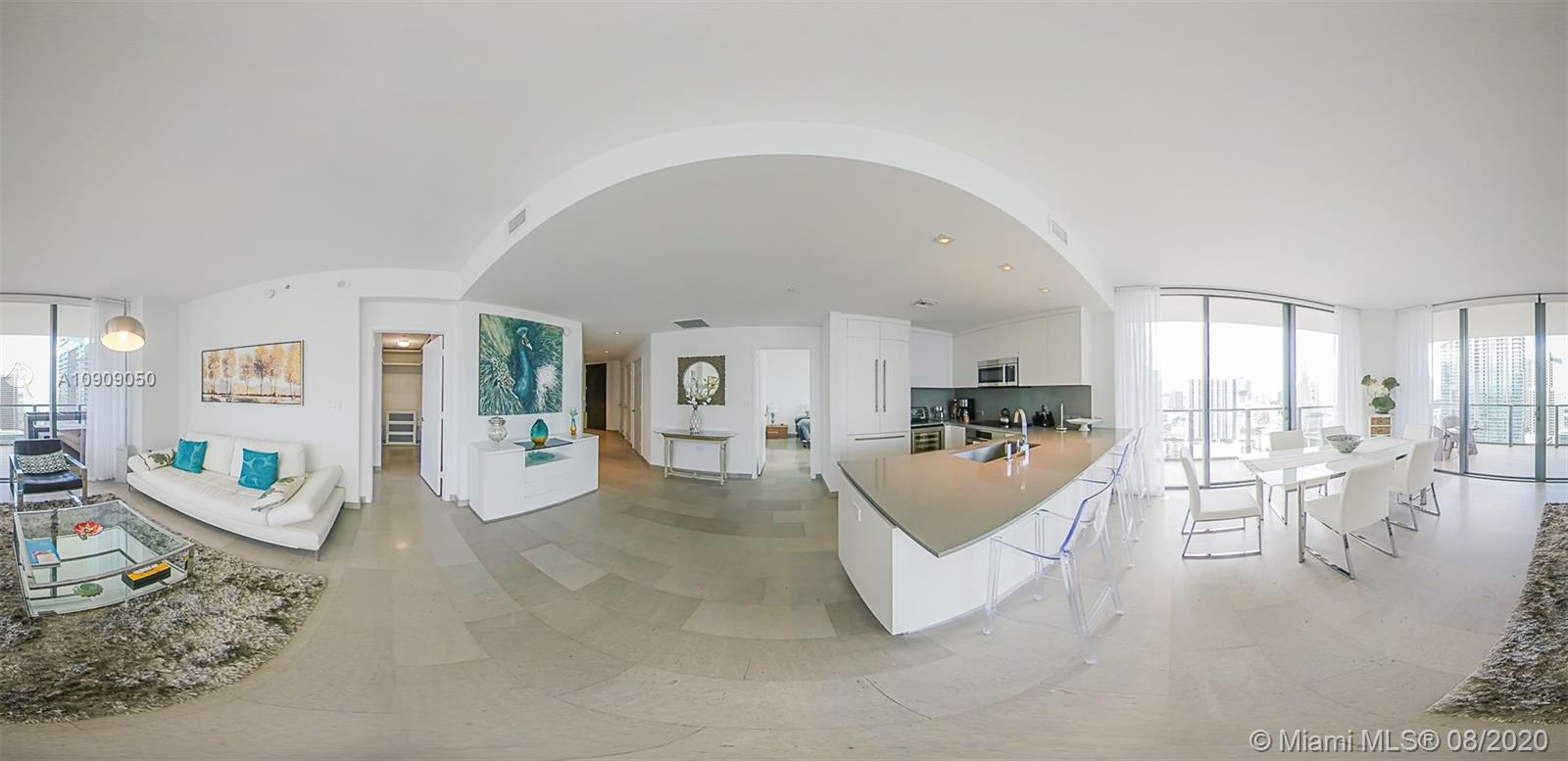 88 Southwest 7th Street, Unit 2911 Miami, FL 33130 - Photo 6 of 25 a living room with furniture and a table