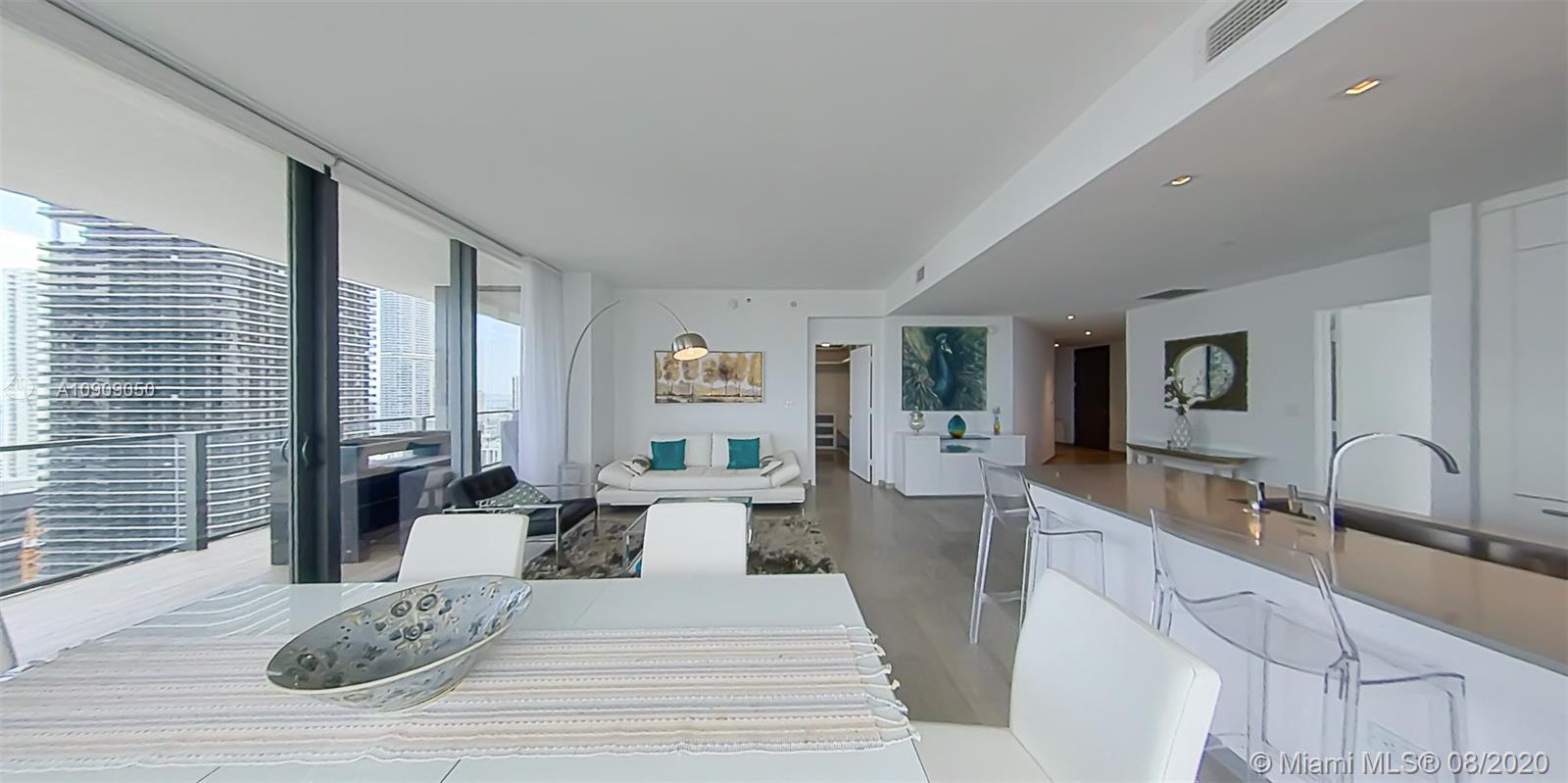 88 Southwest 7th Street, Unit 2911 Miami, FL 33130 - Photo 10 of 25 a large bedroom with a large bed and furniture