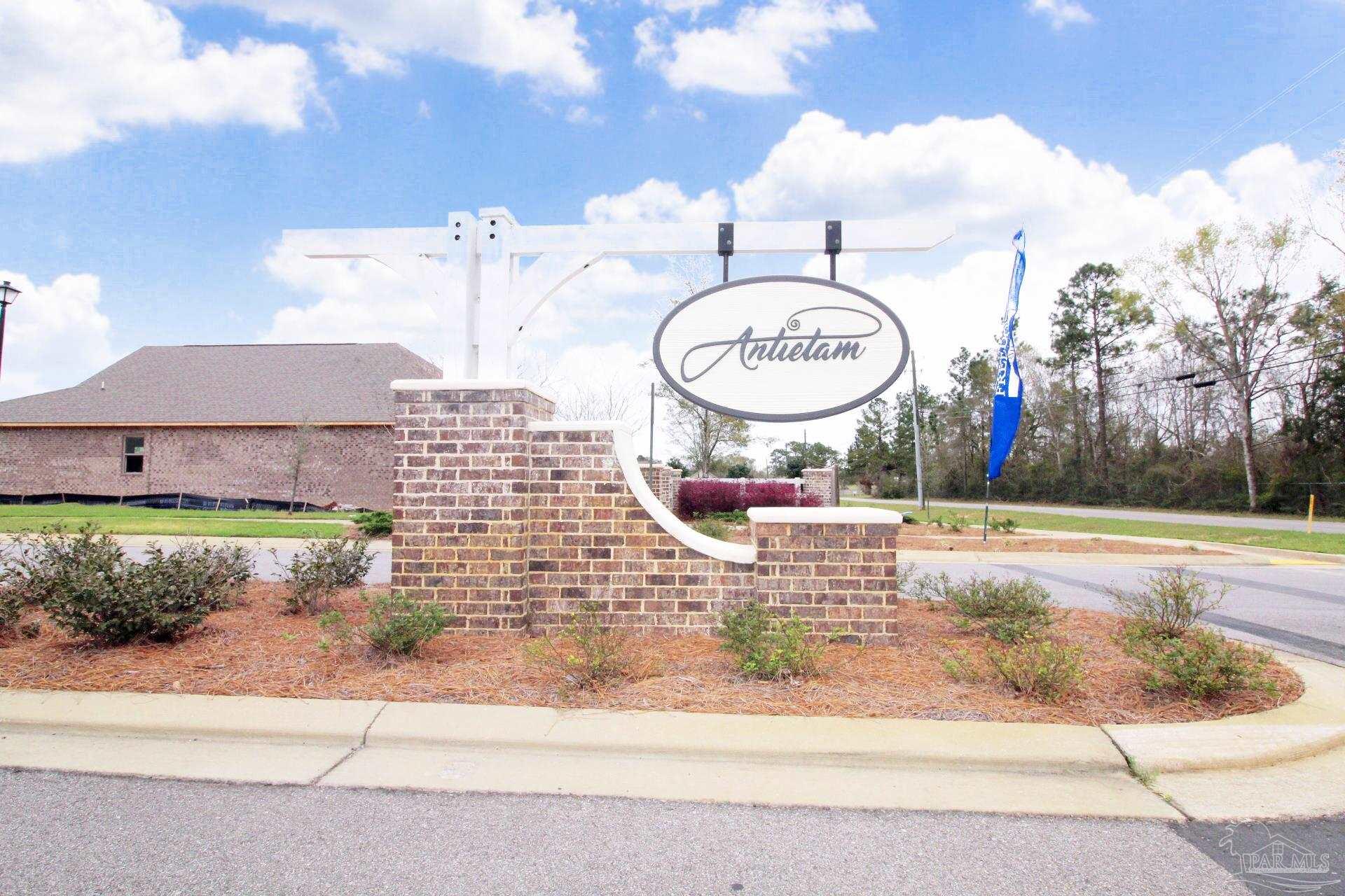 8006 Burnside Loop Pensacola, FL 32526 - Photo 2 of 22 a view of a house with a swimming pool and a yard