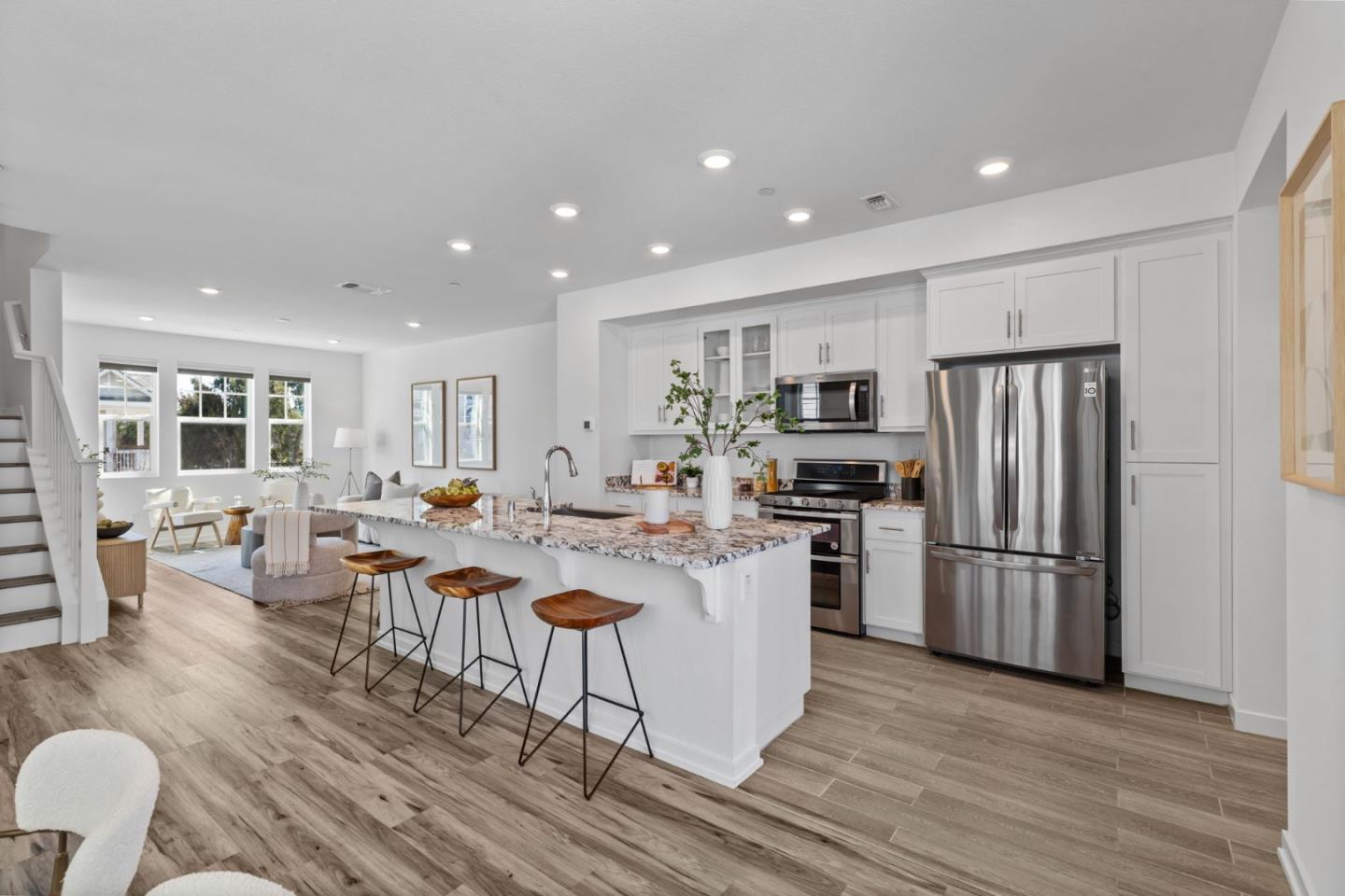3908 Degree Lane Mountain View, CA 94043 - Photo 8 of 32 a large kitchen with a table chairs refrigerator and wooden floor