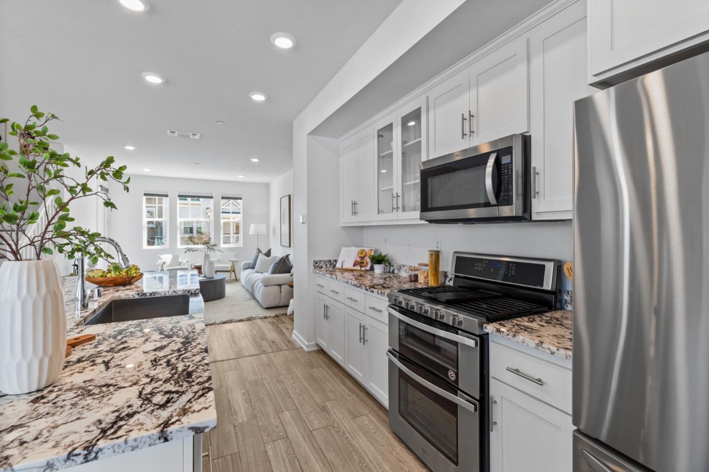 3908 Degree Lane Mountain View, CA 94043 - Photo 9 of 32 a kitchen with a sink stove microwave and refrigerator