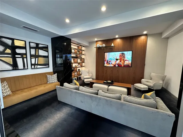 a living room with a furniture and a rug