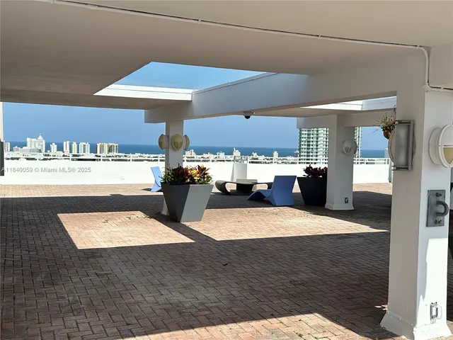 a view of a swimming pool and lounge chair