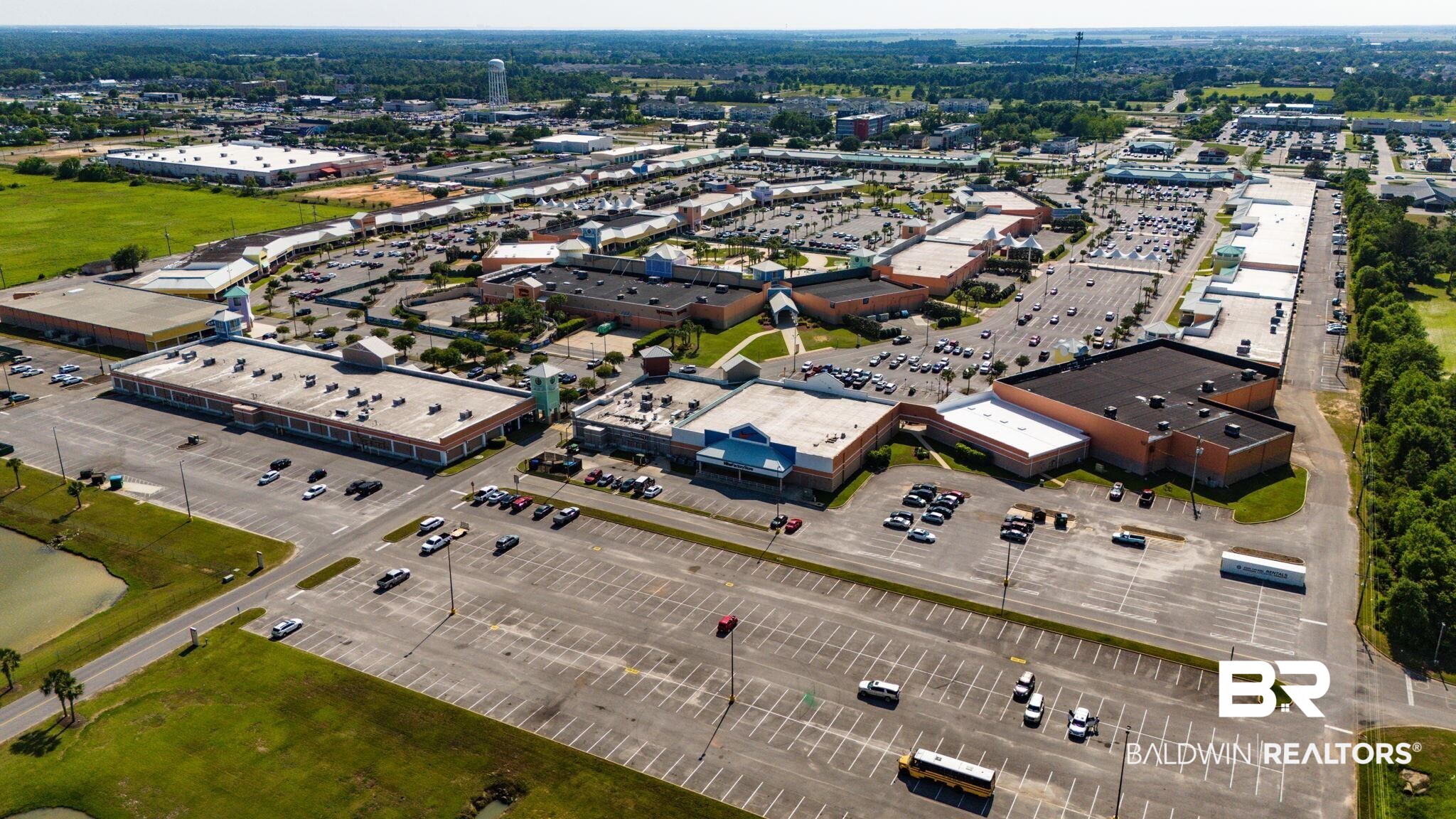 2651 South Juniper Street, Unit 705 Foley, AL 36535 - Photo 28 of 37 Expansive commercial complex featuring multiple retail buildings with ample surface parking