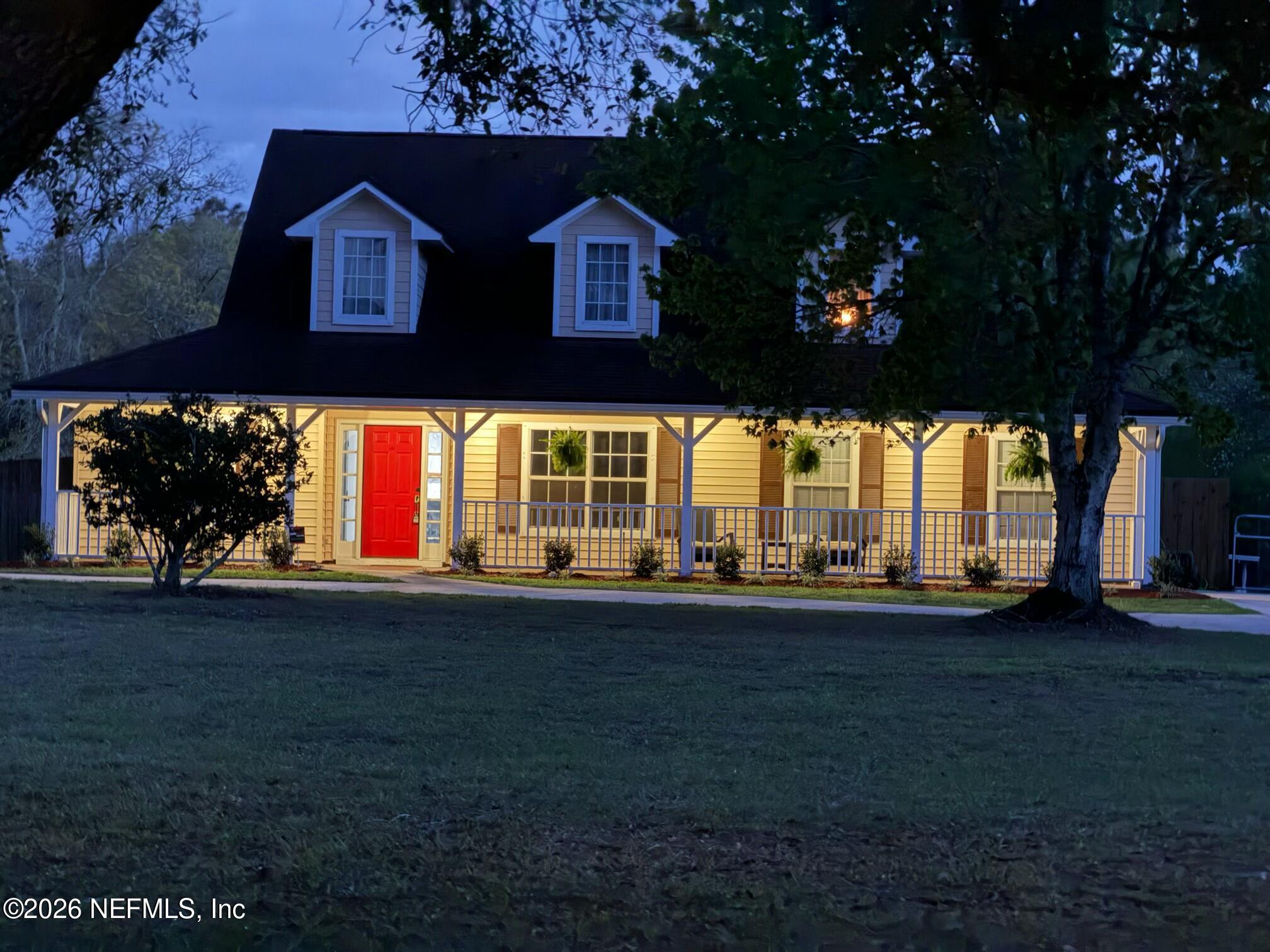 10293 Ford Road Bryceville, FL 32009 - Photo 2 of 63 a front view of a house with a yard