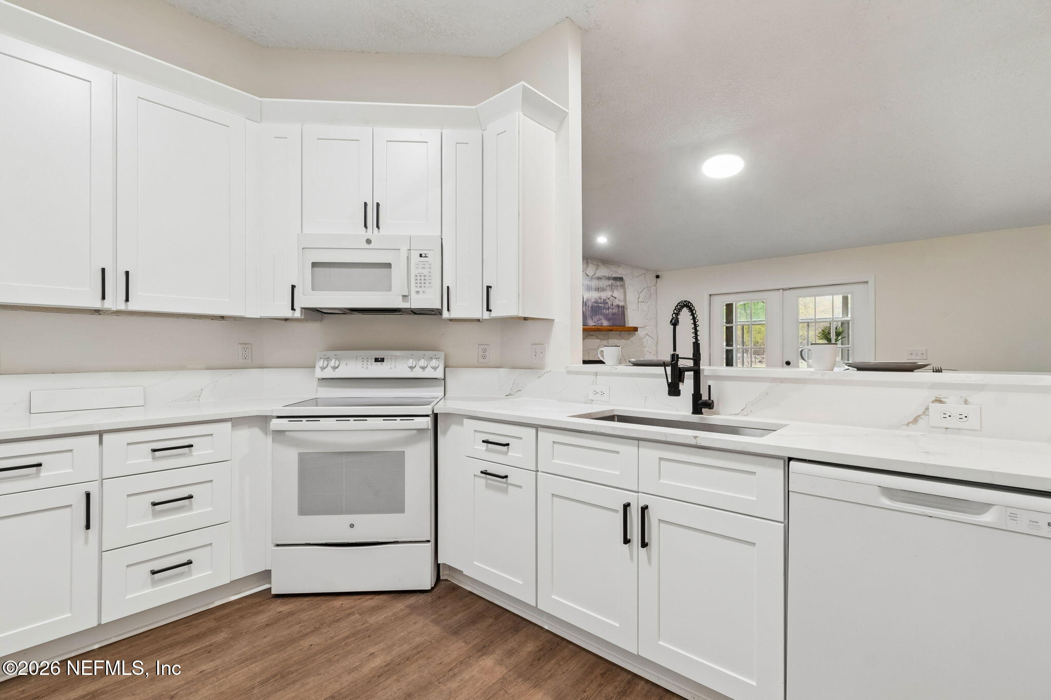 10293 Ford Road Bryceville, FL 32009 - Photo 21 of 63 a kitchen with appliances cabinets and a sink