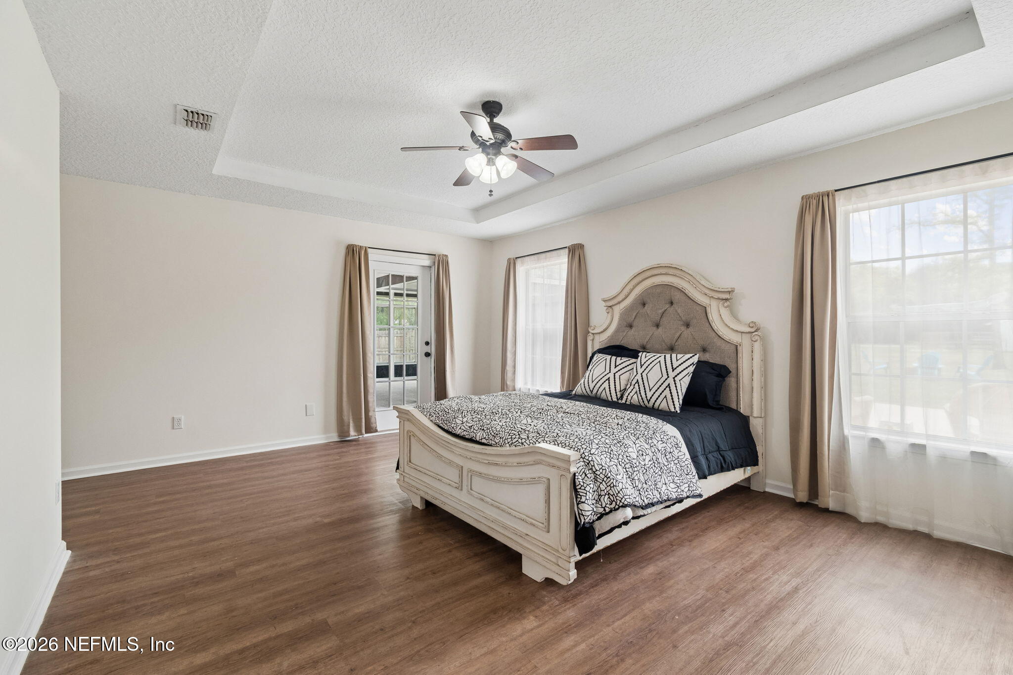 10293 Ford Road Bryceville, FL 32009 - Photo 23 of 63 a bed sitting in a spacious bedroom next to a window