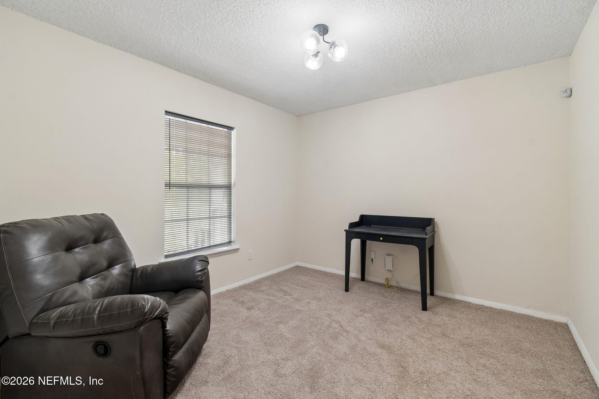 10293 Ford Road Bryceville, FL 32009 - Photo 25 of 63 a livingroom with workspace and a couch