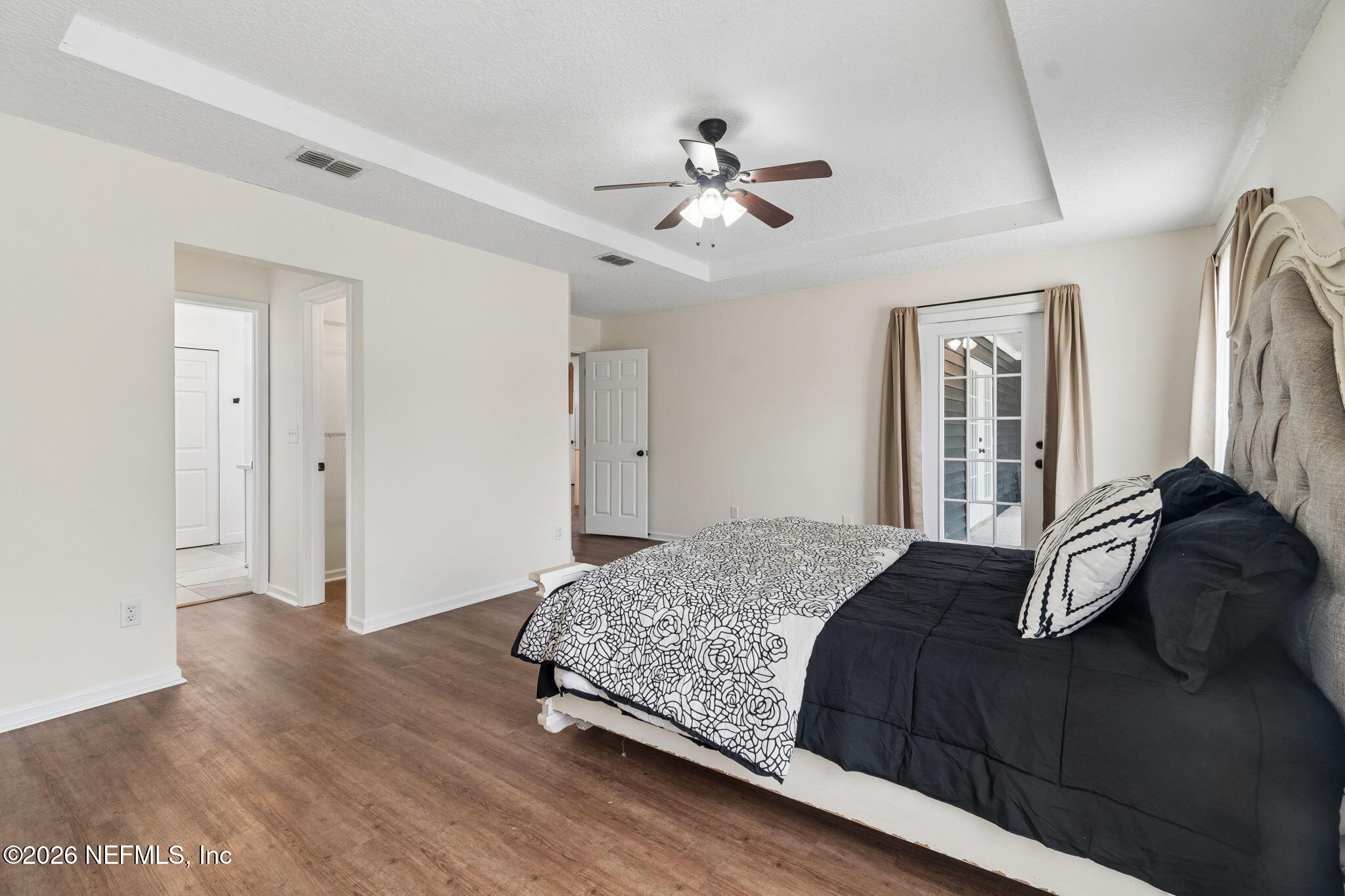 10293 Ford Road Bryceville, FL 32009 - Photo 27 of 63 a bedroom with a bed and wooden floor