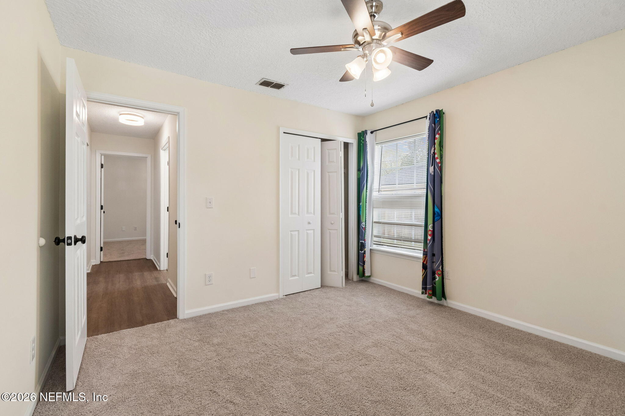10293 Ford Road Bryceville, FL 32009 - Photo 34 of 63 an empty room with closet and a ceiling fan