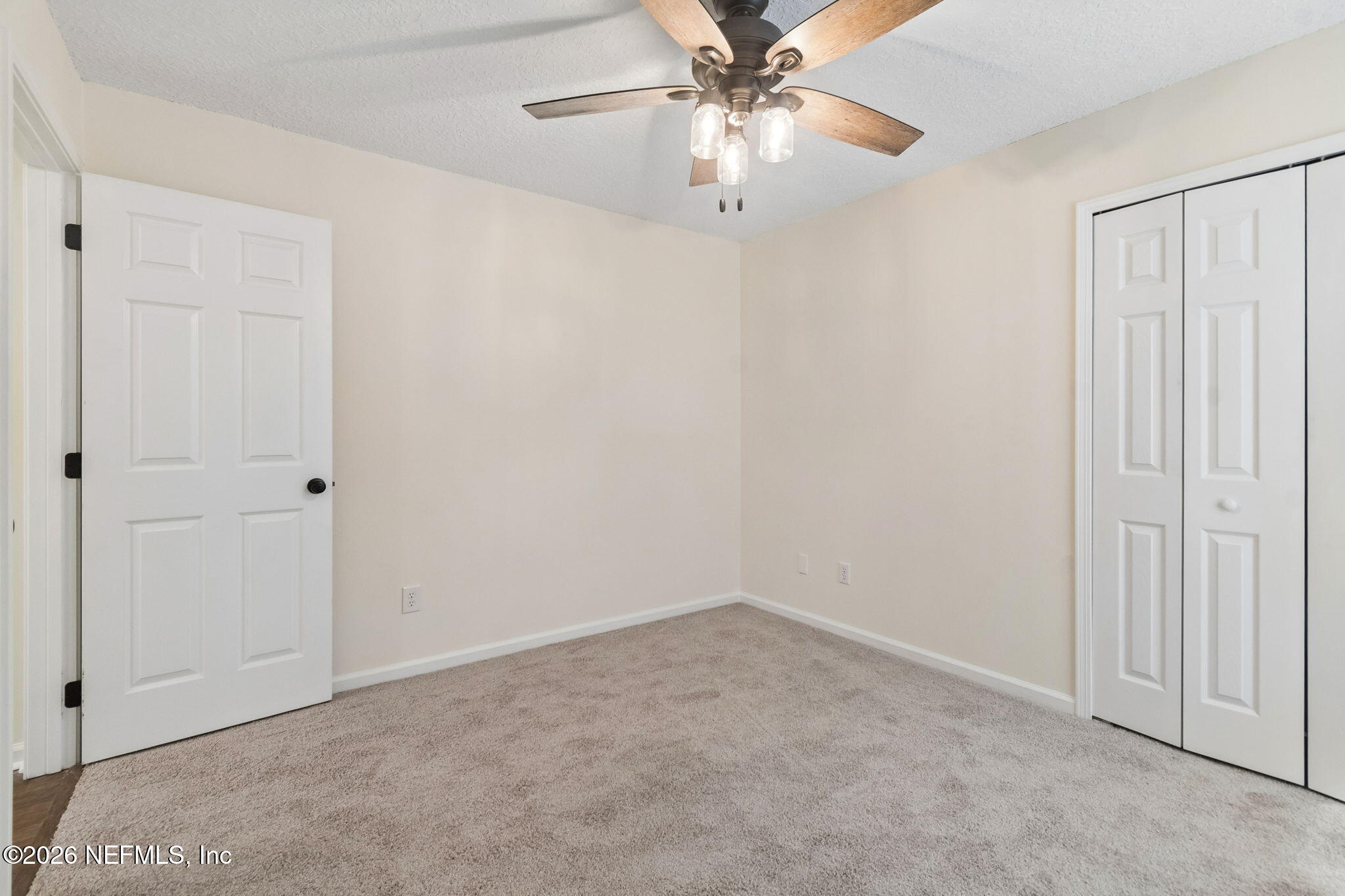 10293 Ford Road Bryceville, FL 32009 - Photo 38 of 63 an empty room with windows and fan