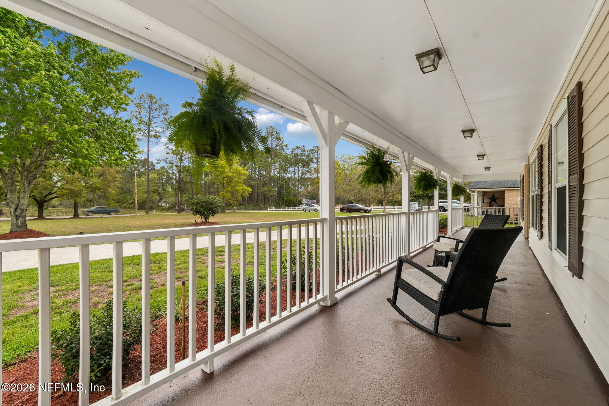 10293 Ford Road Bryceville, FL 32009 - Photo 4 of 63 a view of a two chair in the balcony