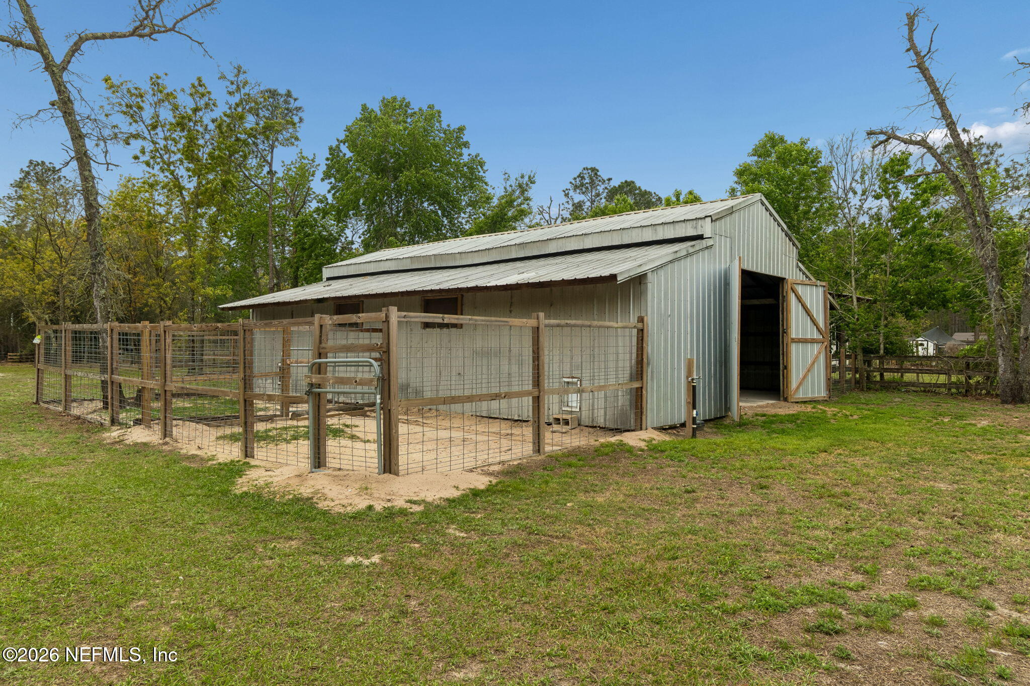 10293 Ford Road Bryceville, FL 32009 - Photo 43 of 63 a view of a house with a yard