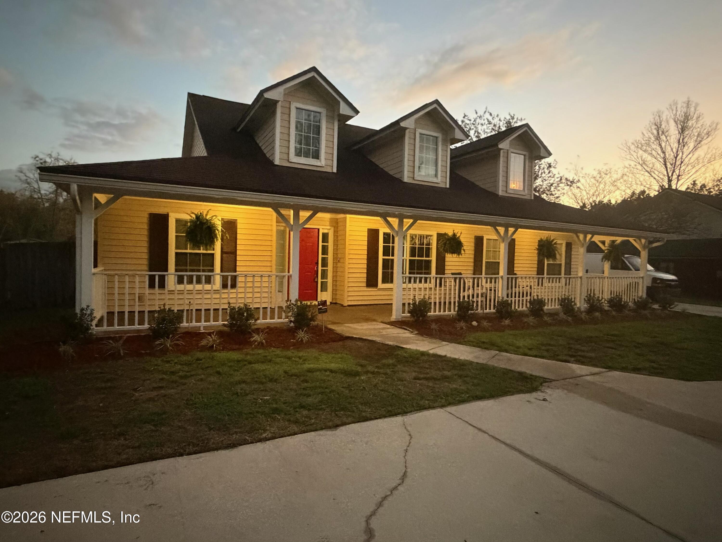 10293 Ford Road Bryceville, FL 32009 - Photo 63 of 63 a front view of a house with a yard