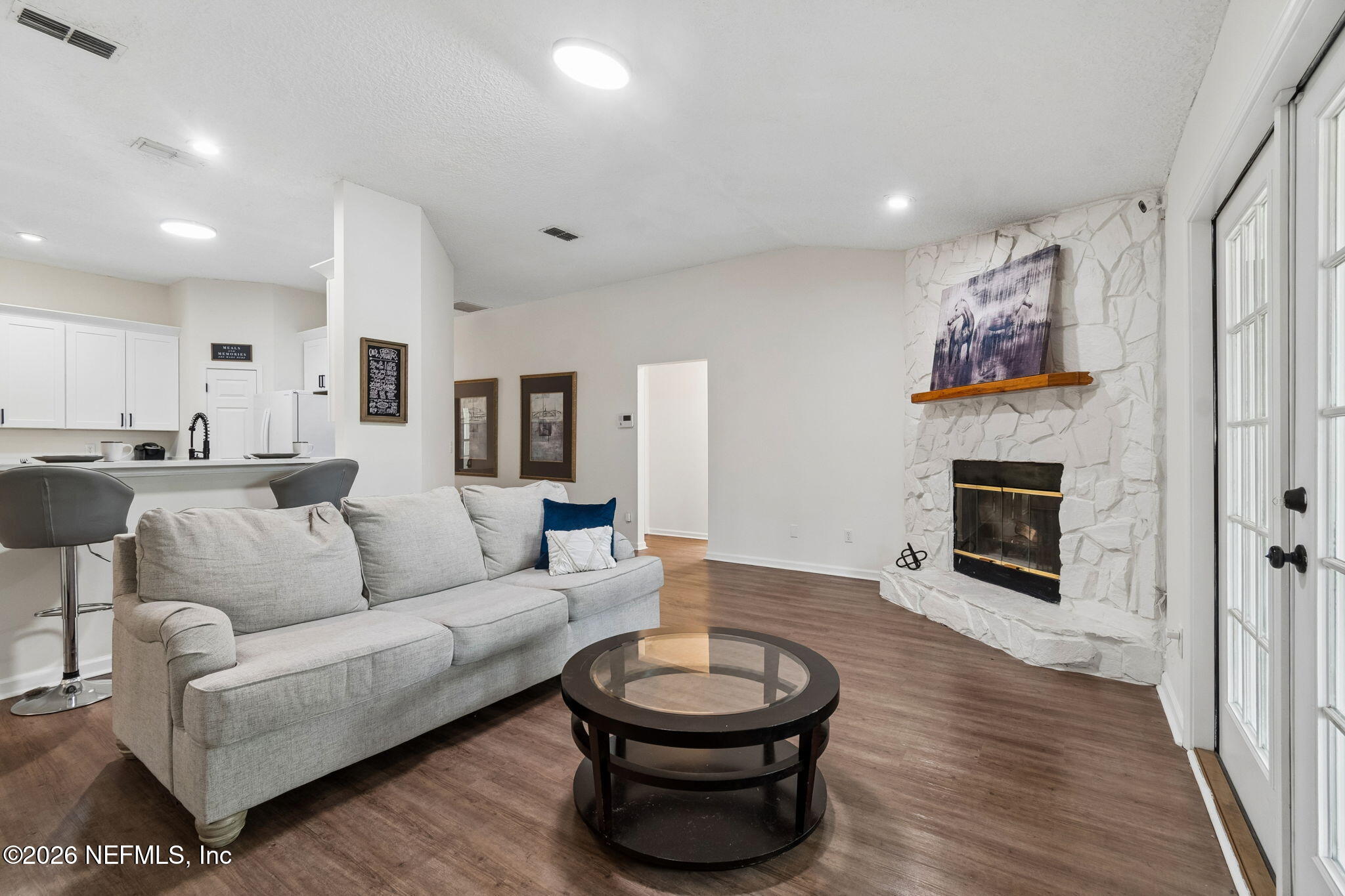 10293 Ford Road Bryceville, FL 32009 - Photo 9 of 63 a living room with furniture a fireplace and a wooden floor