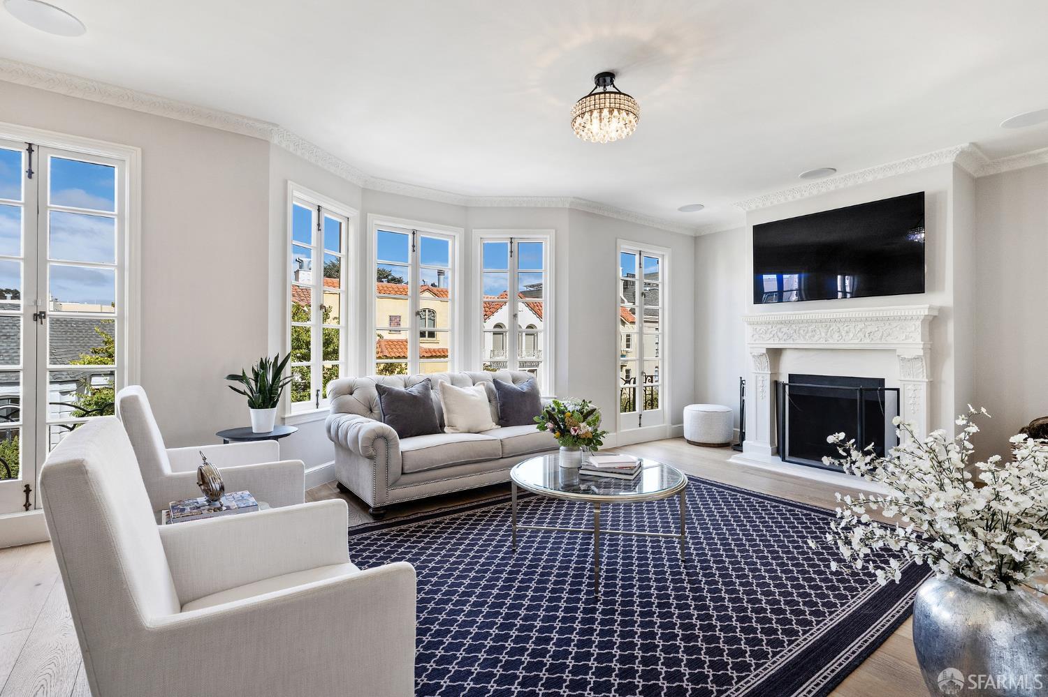 Webster Street San Francisco, CA 94123 - Photo 20 of 83 a living room with furniture a flat screen tv and a fireplace