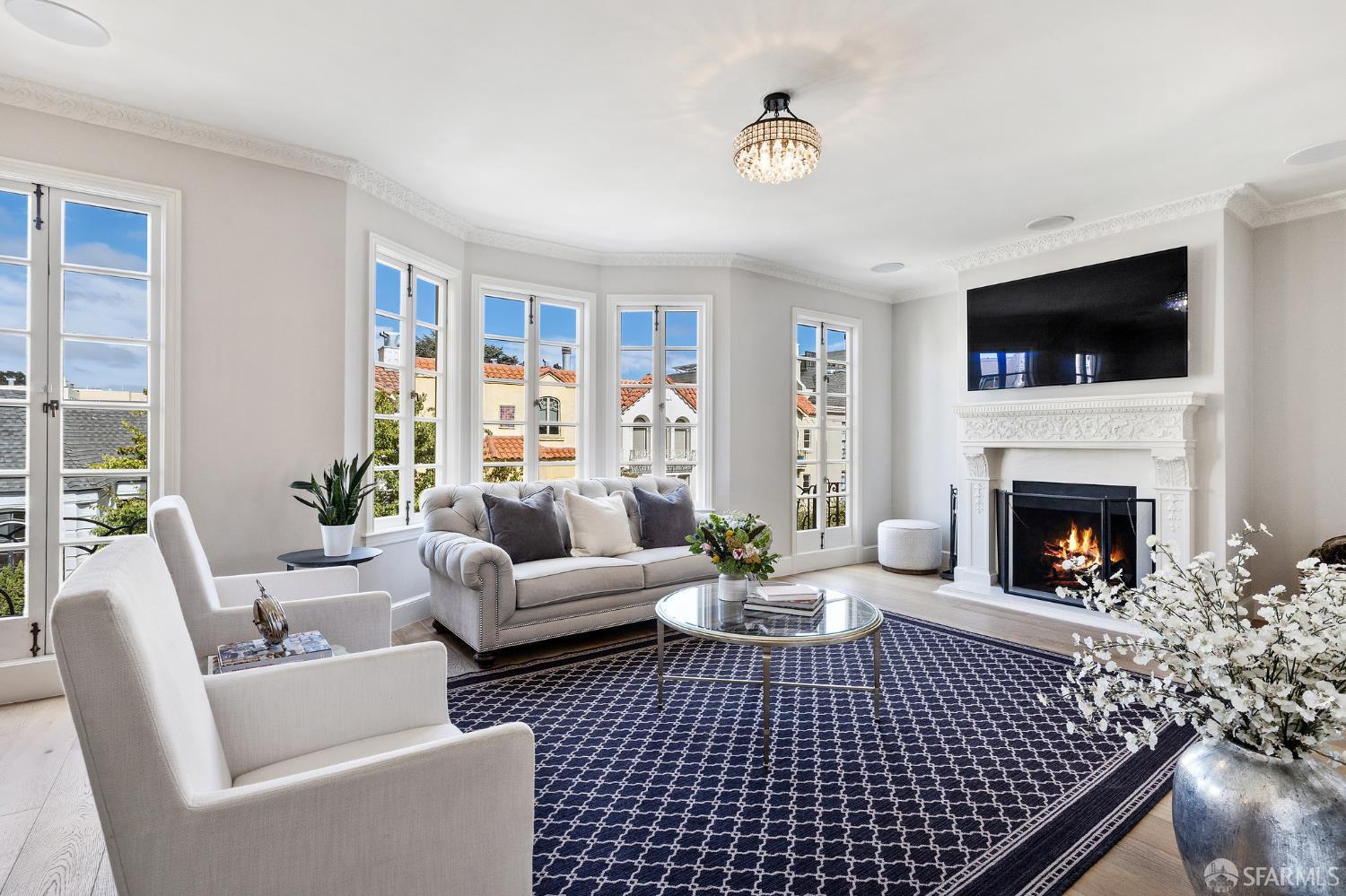 Webster Street San Francisco, CA 94123 - Photo 21 of 83 a living room with furniture a flat screen tv and a fireplace