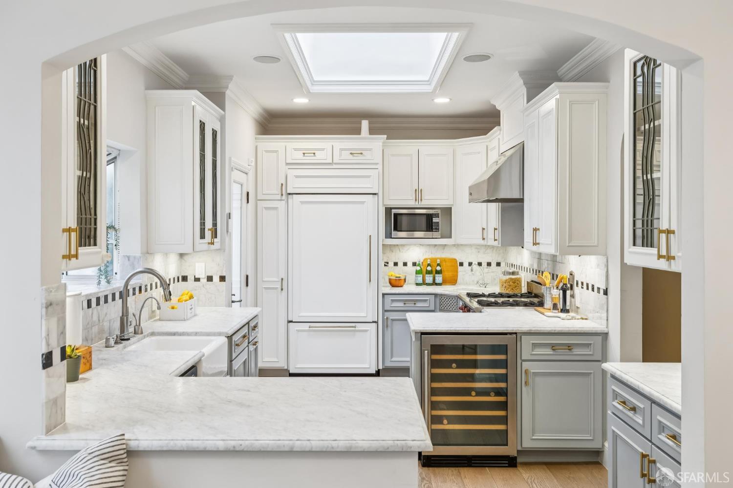 3641 Webster Street San Francisco, CA 94123 - Photo 22 of 52 a kitchen with stainless steel appliances a stove a sink and a refrigerator