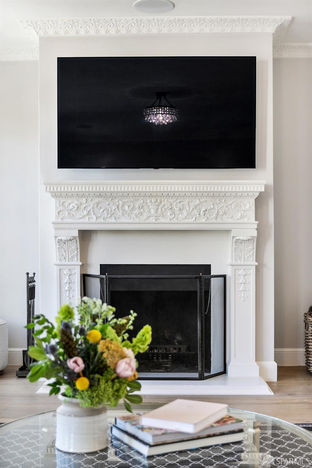 Webster Street San Francisco, CA 94123 - Photo 24 of 83 a living room with a fireplace and a potted plant