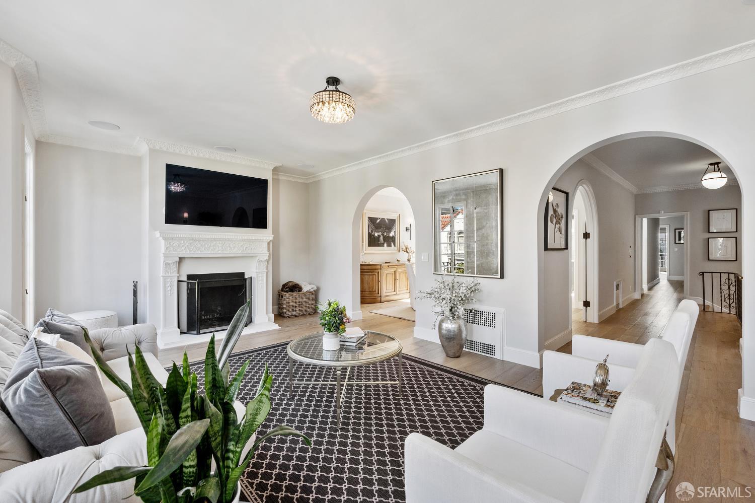 Webster Street San Francisco, CA 94123 - Photo 25 of 83 a living room with furniture a fireplace and a flat screen tv