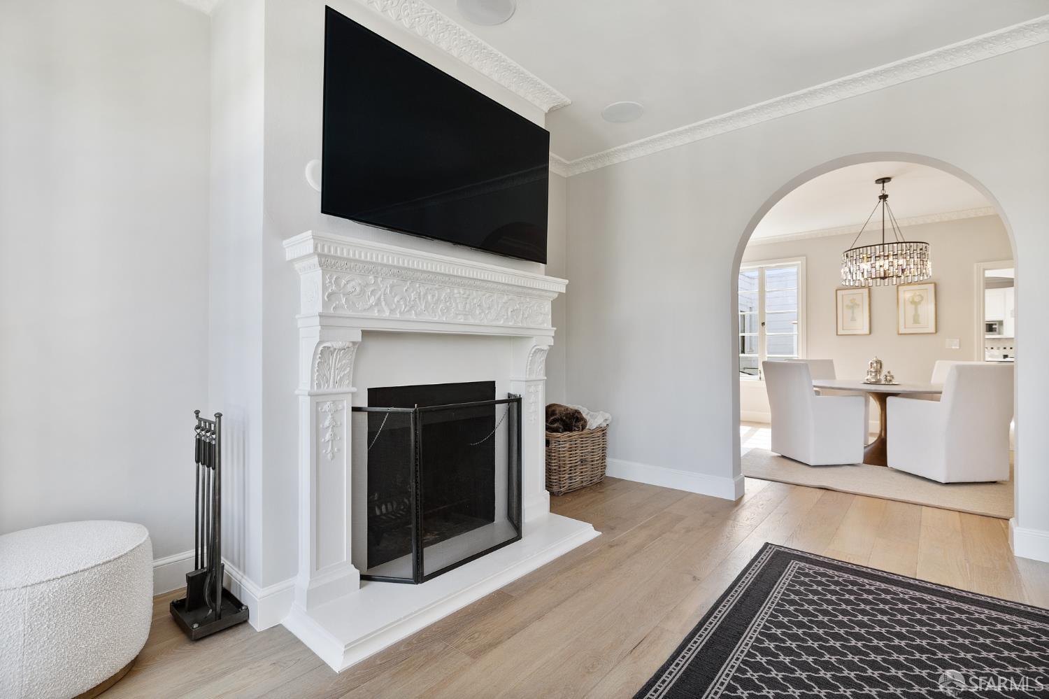 Webster Street San Francisco, CA 94123 - Photo 31 of 83 a living room with a fireplace and a flat screen tv