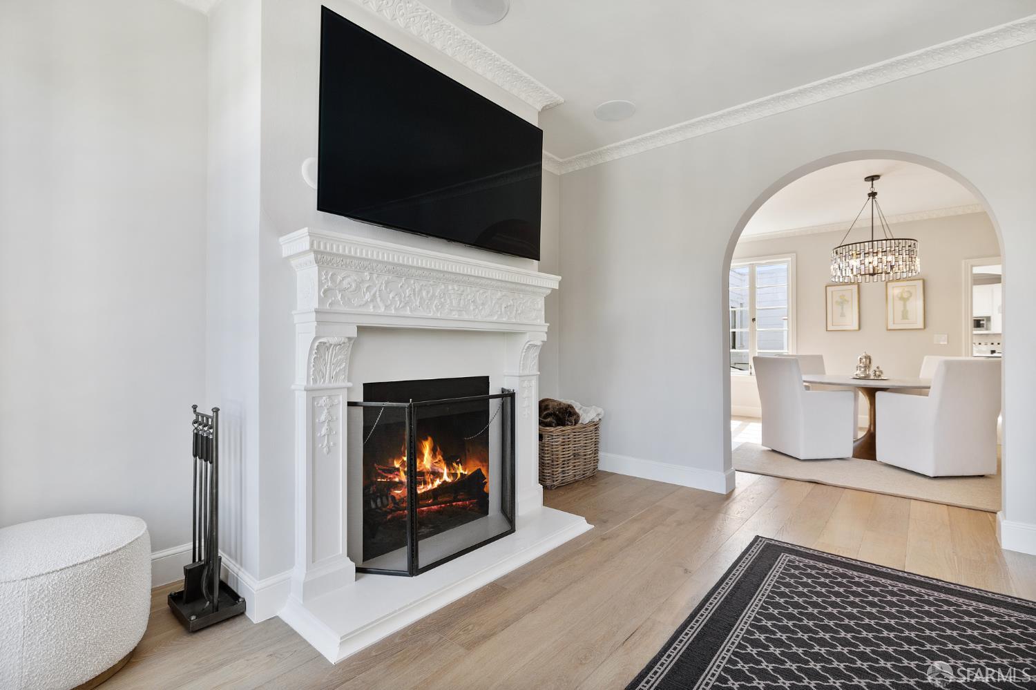 Webster Street San Francisco, CA 94123 - Photo 32 of 83 a living room with a fireplace and a flat screen tv
