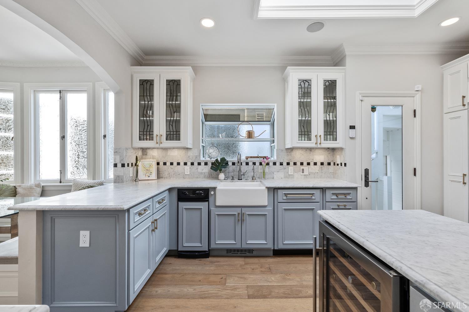 Webster Street San Francisco, CA 94123 - Photo 43 of 83 a kitchen with a sink stove a refrigerator and white cabinets