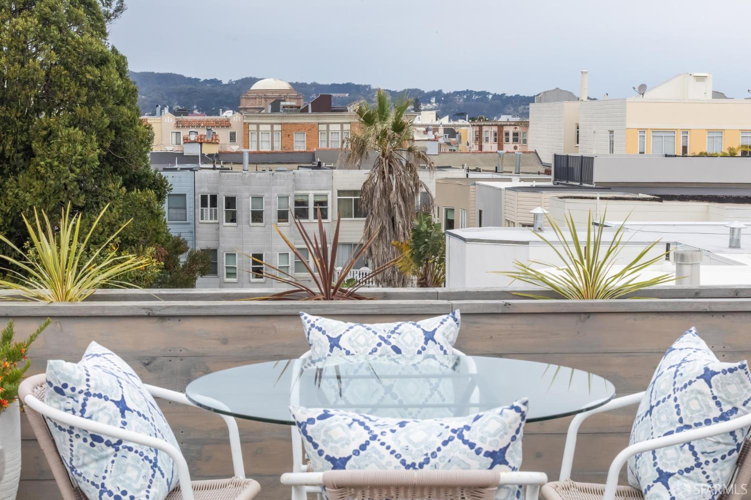 3641 Webster Street San Francisco, CA 94123 - Photo 43 of 52 a view of a dining room with furniture and a potted plant