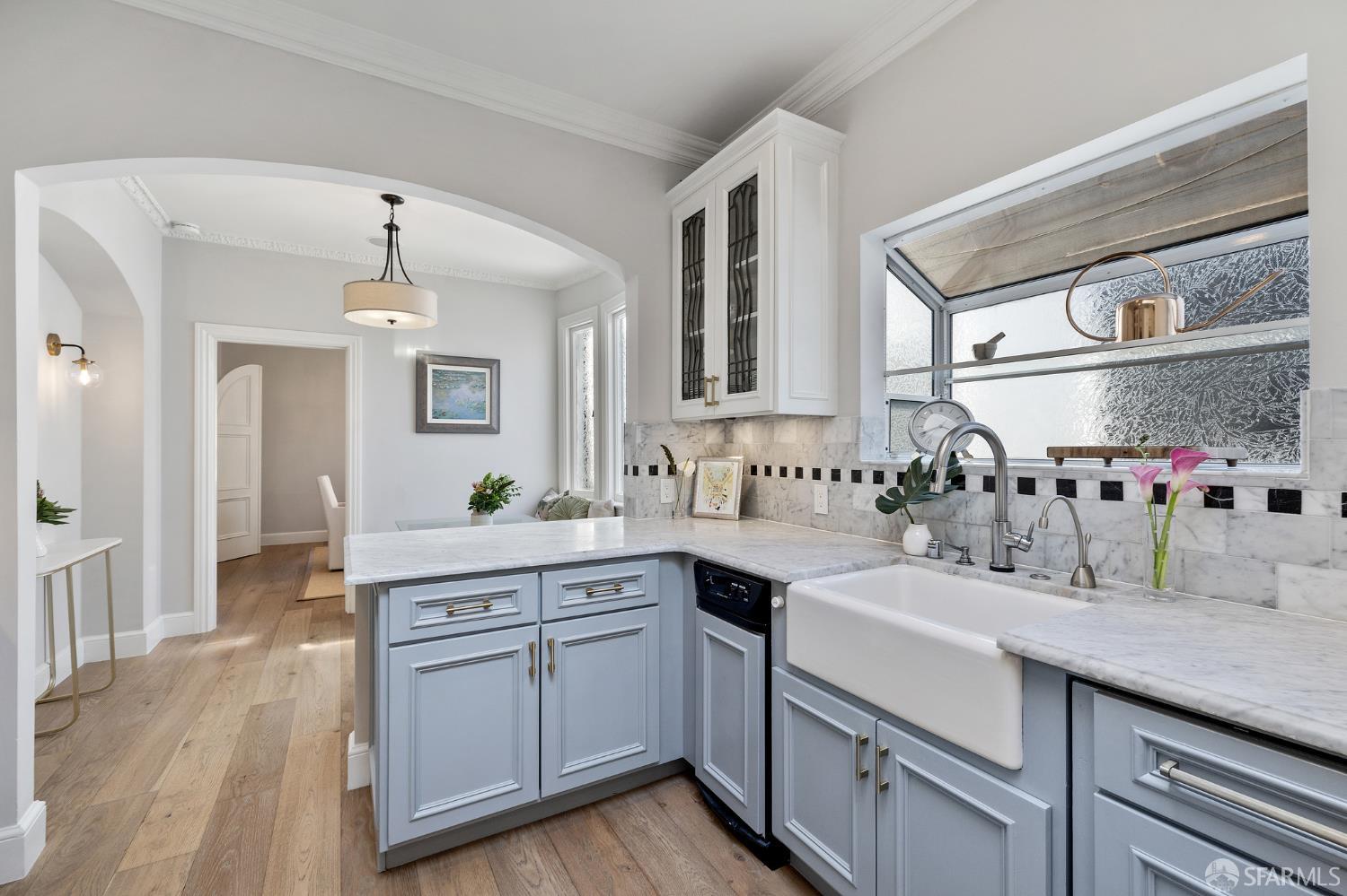 Webster Street San Francisco, CA 94123 - Photo 44 of 83 a kitchen with a sink stove and cabinets