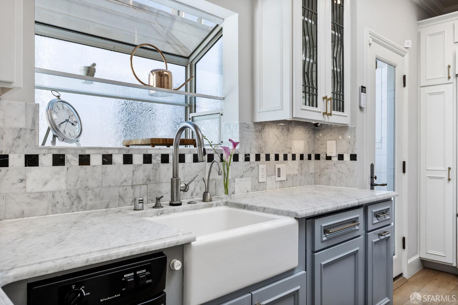 Webster Street San Francisco, CA 94123 - Photo 45 of 83 a kitchen with stainless steel appliances a sink and cabinets