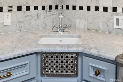 an aerial view of a residential houses with city view