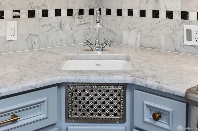 an aerial view of a residential houses with city view