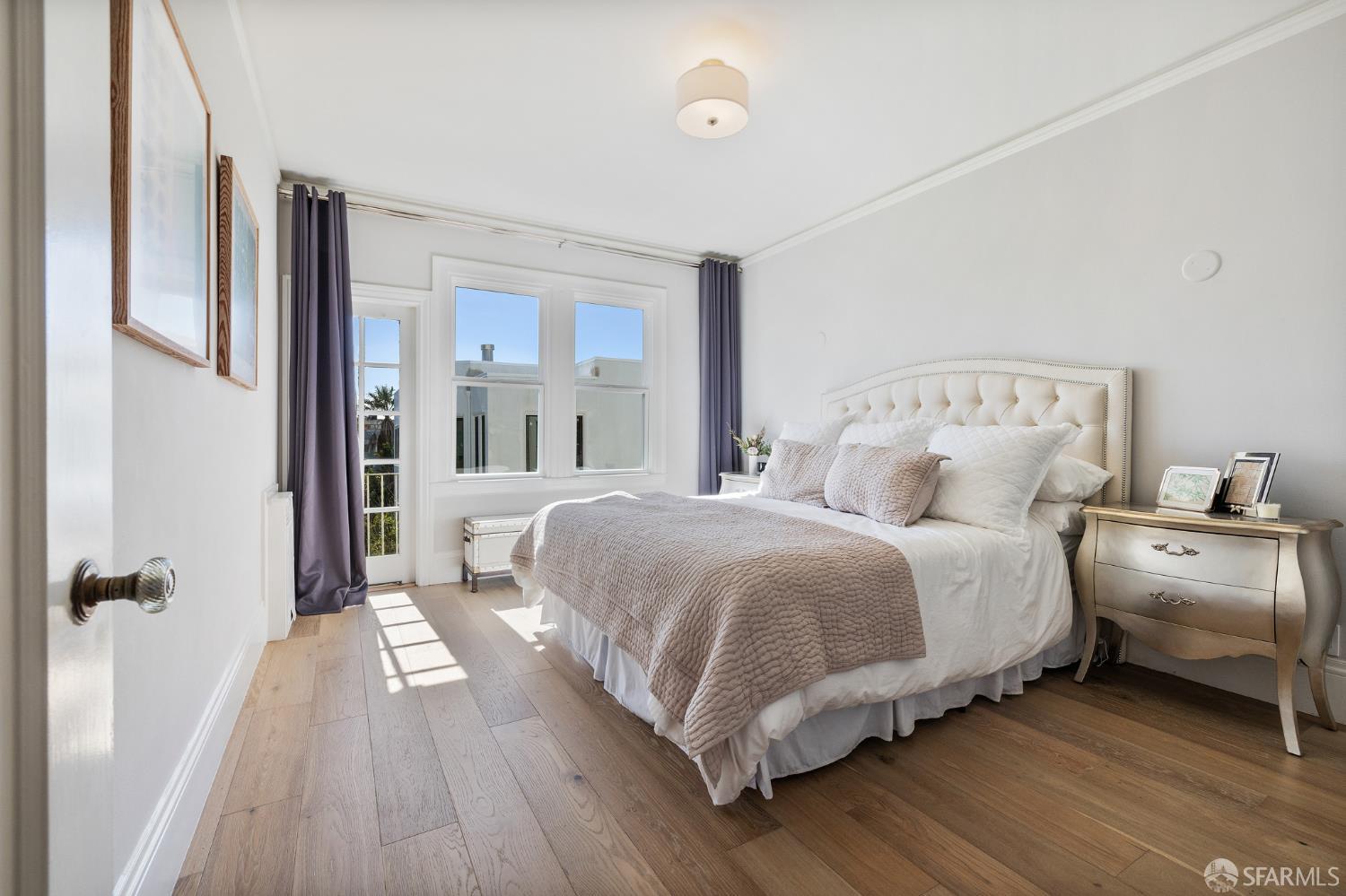 Webster Street San Francisco, CA 94123 - Photo 53 of 83 a bedroom with a bed and a large window