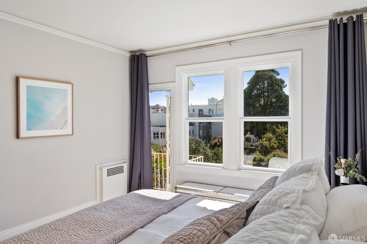 Webster Street San Francisco, CA 94123 - Photo 55 of 83 a bedroom with a bed and a large window