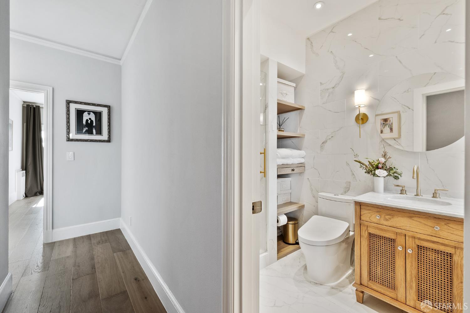 Webster Street San Francisco, CA 94123 - Photo 60 of 83 a bathroom with a toilet sink and a mirror