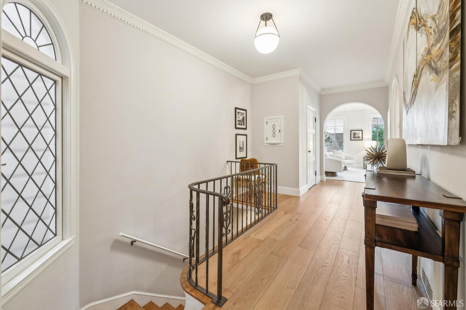3641 Webster Street San Francisco, CA 94123 - Photo 6 of 52 a view of a room with wooden floor windows and a chandelier