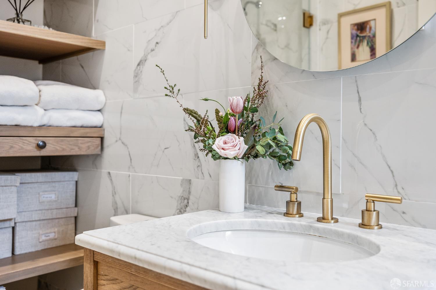 Webster Street San Francisco, CA 94123 - Photo 64 of 83 a bathroom with a sink and a mirror