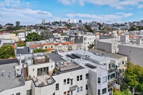 an aerial view of a city with lots of residential buildings