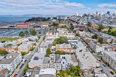 a front view of residential houses with stairs