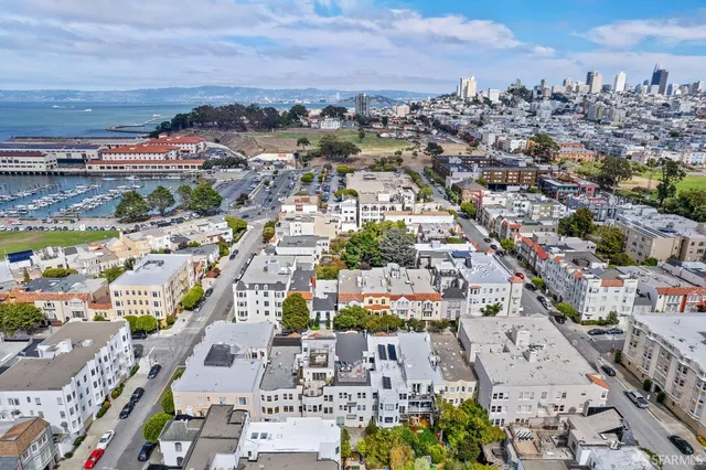 a front view of residential houses with stairs