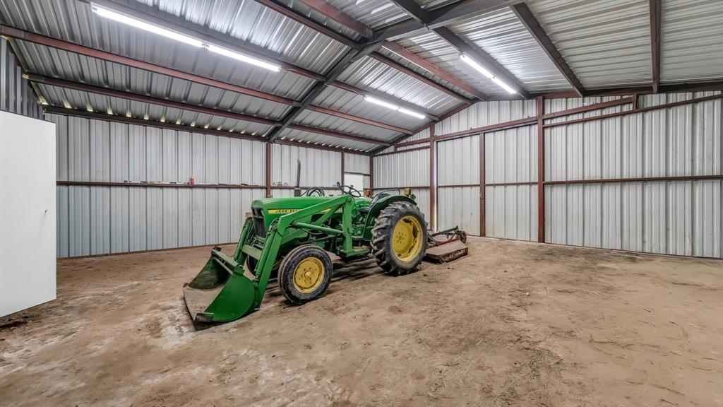 3810 Fairview Road Millsap, TX 76066 - Photo 19 of 25 Garage with metal wall